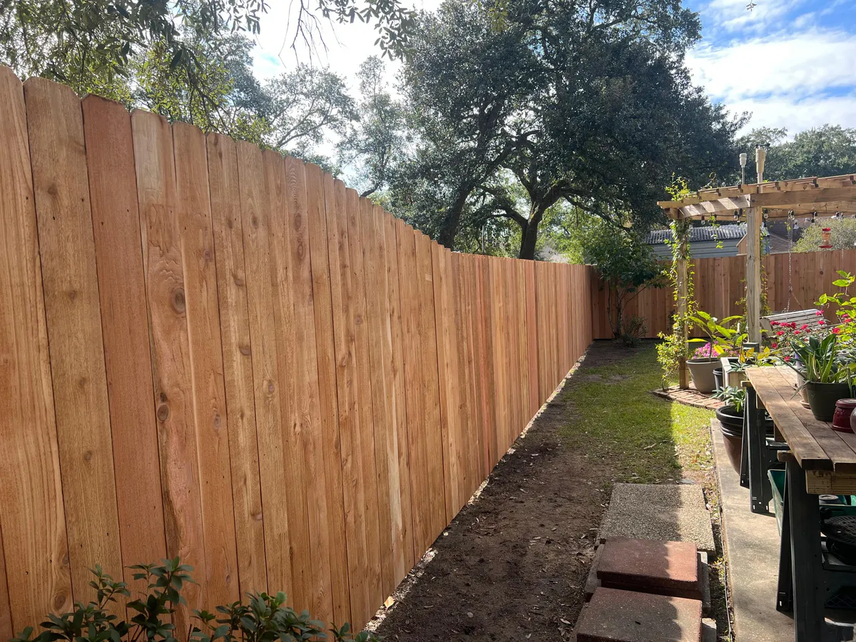 Wooden fence installed around a residential yard in Slidell